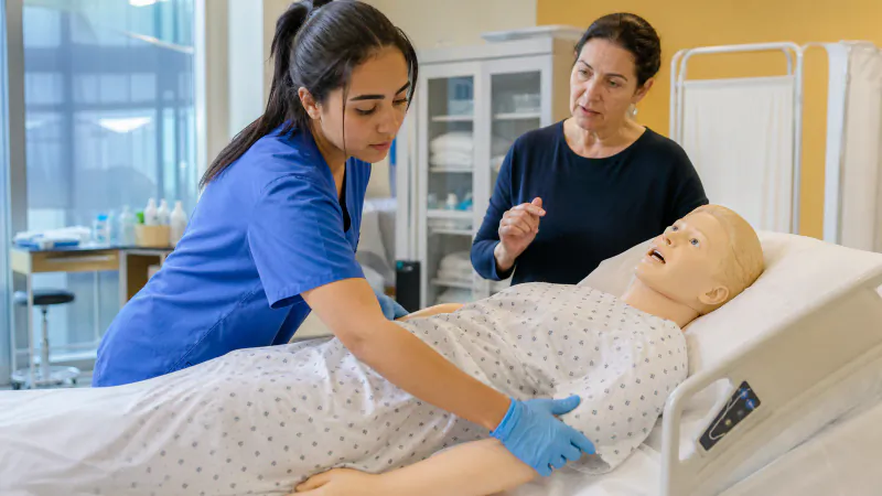International nursing apprentice practising a safe handover with her practice educator